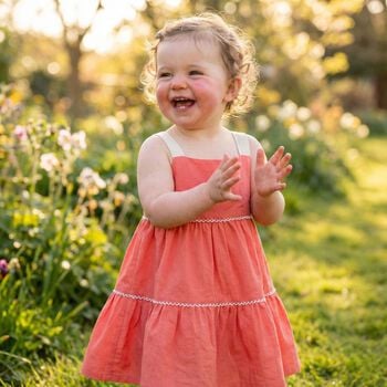 فستان للفتيات الصغيرات مزين بفيونكة باللون المرجاني 