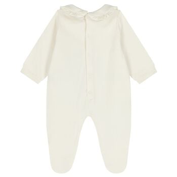 بدلة أطفالة باللون عاجية بشعار